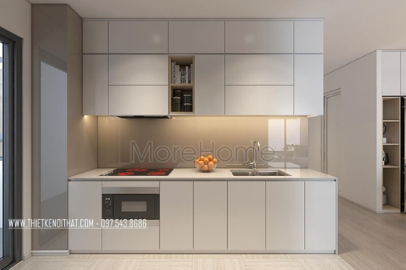 Mẫu tủ bếp kiểu dáng chữ i gỗ acrylic màu trắng kết hợp phân chia các ngăn tủ một cách hợp lí, tạo cho người nội trợ thuận tiện hơn trong quá trình mang lại những bữa cơm ngon miệng cho những người thân yêu của mình Tủ bếp màu trắng