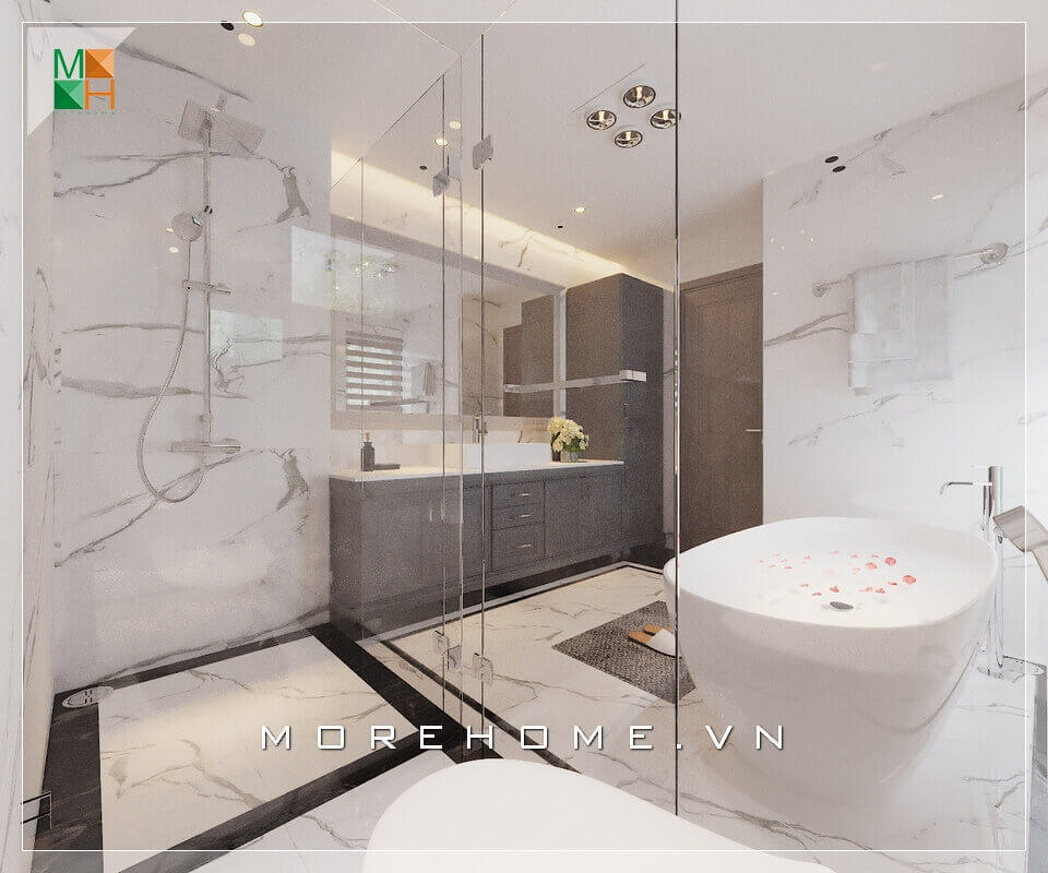 Với mẫu phòng tắm có diện tích lớn có thể thiết kế vách tắm bằng kính cường lực để chia thành các khu vực như khu vực tắm đứng, khu vực vệ sinh, khu vực tắm bồn và khu tủ lavabo, vừa giúp ngăn nước và giữ sàn khô ráo mà vẫn có sự liên kết trong không gian phòng tắm Mẫu vách kính tắm cao cấp