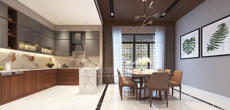 Sắp xếp nội thất phòng bếp liền phòng ăn sang trọng, độc đáo với nội thất gỗ chủ đạo từ tủ bếp, bộ bàn ghế, tường ốp gỗ tại biệt thự, nhà phố Vinh, Nghệ An. Thiết kế phòng ăn đẹp