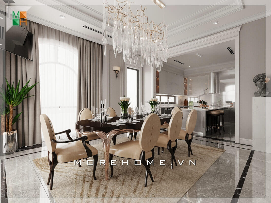 Thiết kế không gian phòng bếp liền phòng ăn rất rộng rãi và thoáng mát, sử dụng đèn chùm treo giữa không gian bàn ăn mang đậm chút tân cổ điện rất đẳng cấp. Thiết kế phòng ăn tại Hà Nội