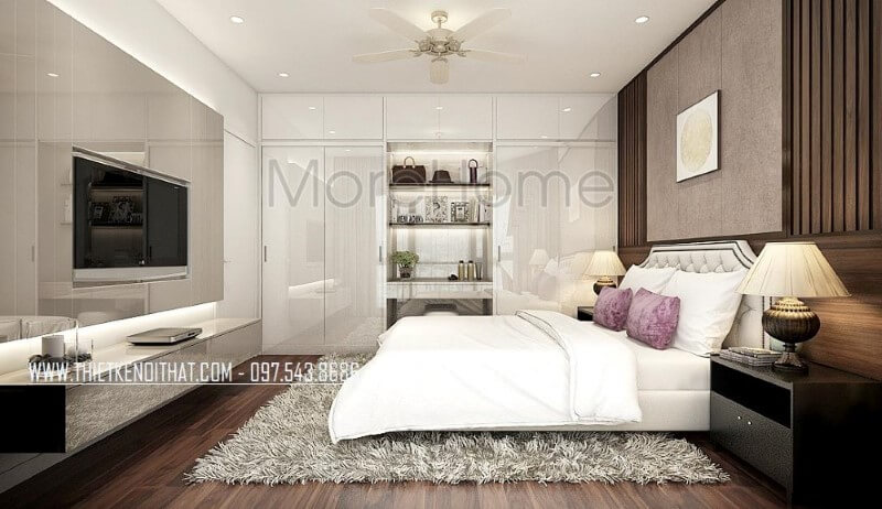 Tủ quần áo hiện đại vừa làm bàn trang điểm vừa để đồ trang trí vừa tận dụng không gian để quần áo với cửa 4 cánh cùng hệ tủ để đồ trên khá ngăn nắp giúp phòng ngủ trở nên gọn gàng, đẹp nhưng vẫn toát lên vẻ sang trọng, độc đáo. Thiết kế phòng ngủ tại Hà Nội