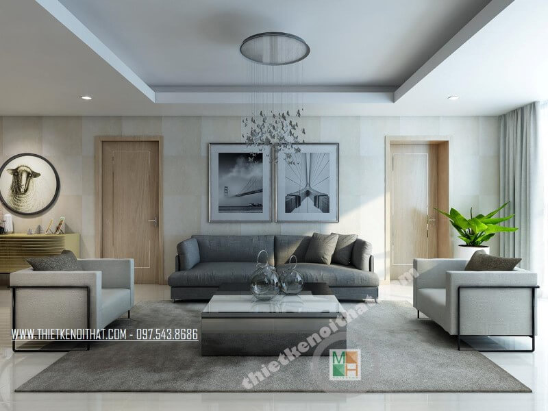 Mẫu thiết kế phòng khách chung cư hiện đại với bộ sofa bọc vài màu xám và trắng tạo điểm nhấn nổi bật cho căn phòng. Trang trí phòng khách
